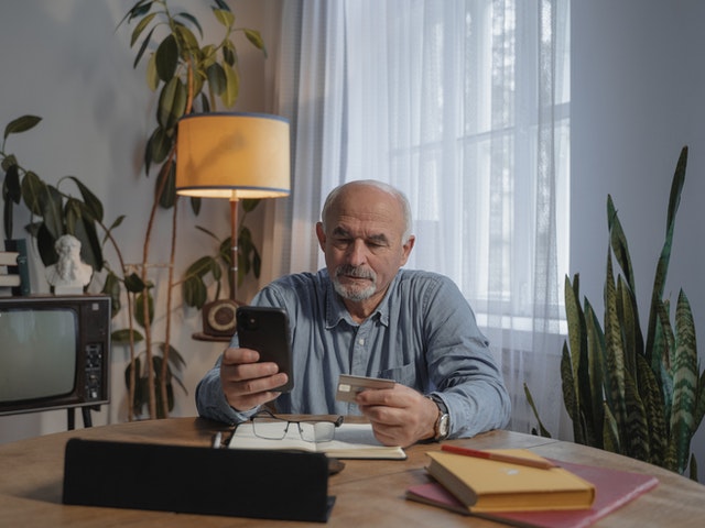 Elderly Man Using A Smartphone