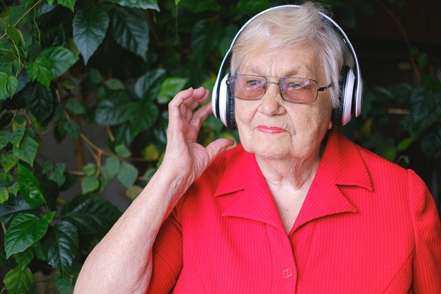 Elderly Woman Listening to Music